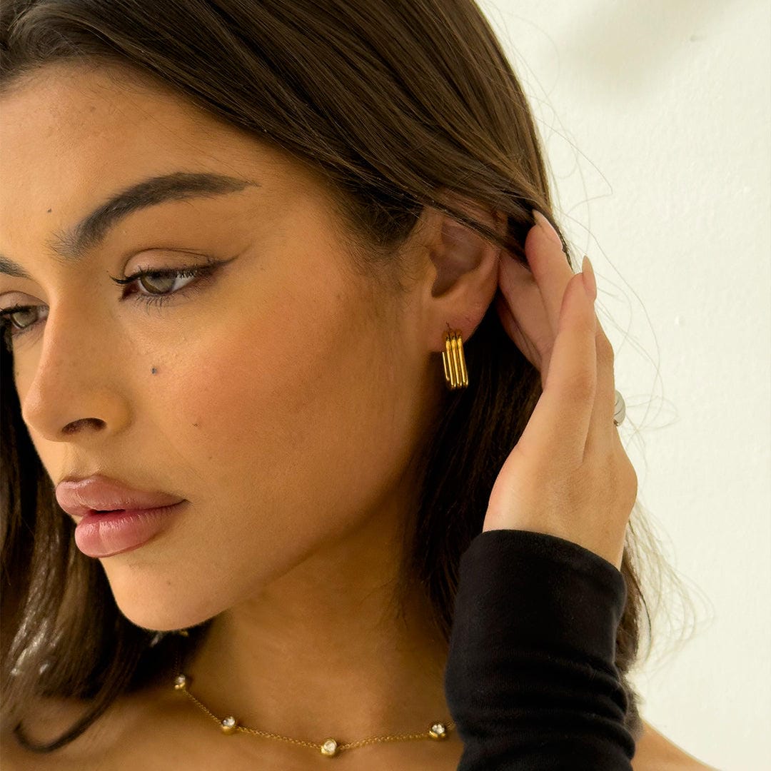 Lustrous Curved Ribbed Gold Earrings